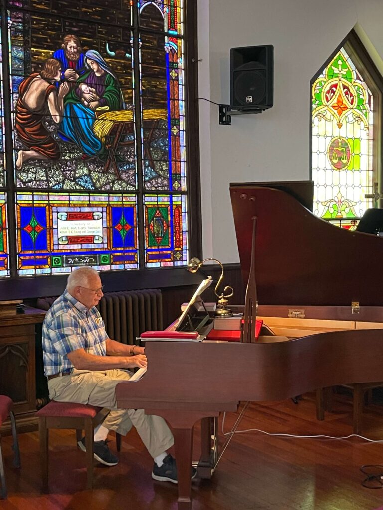 Elderly man playing the piano