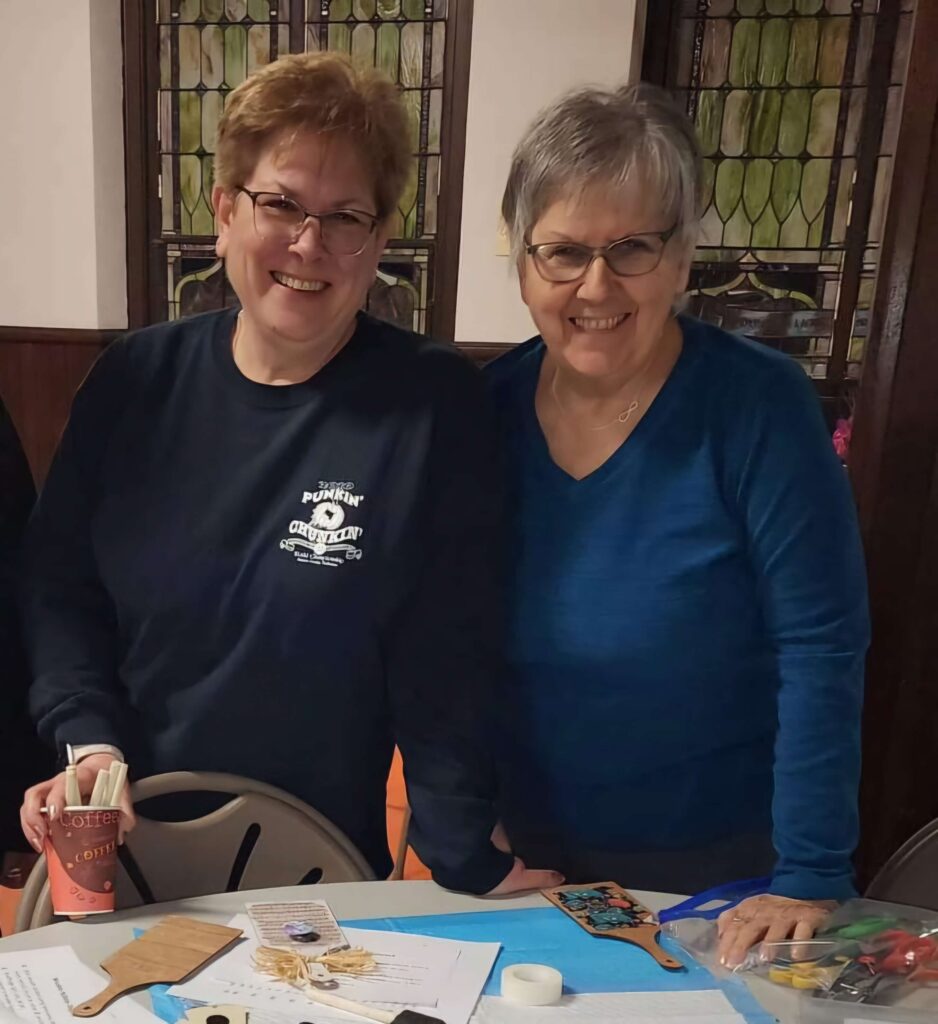 Two elderly women smiling